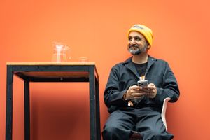 Anil Dash sitting next to a table, 2025